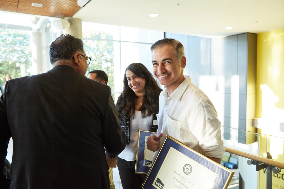 Candid photograph of happy award recipients at Vancouver corporate event