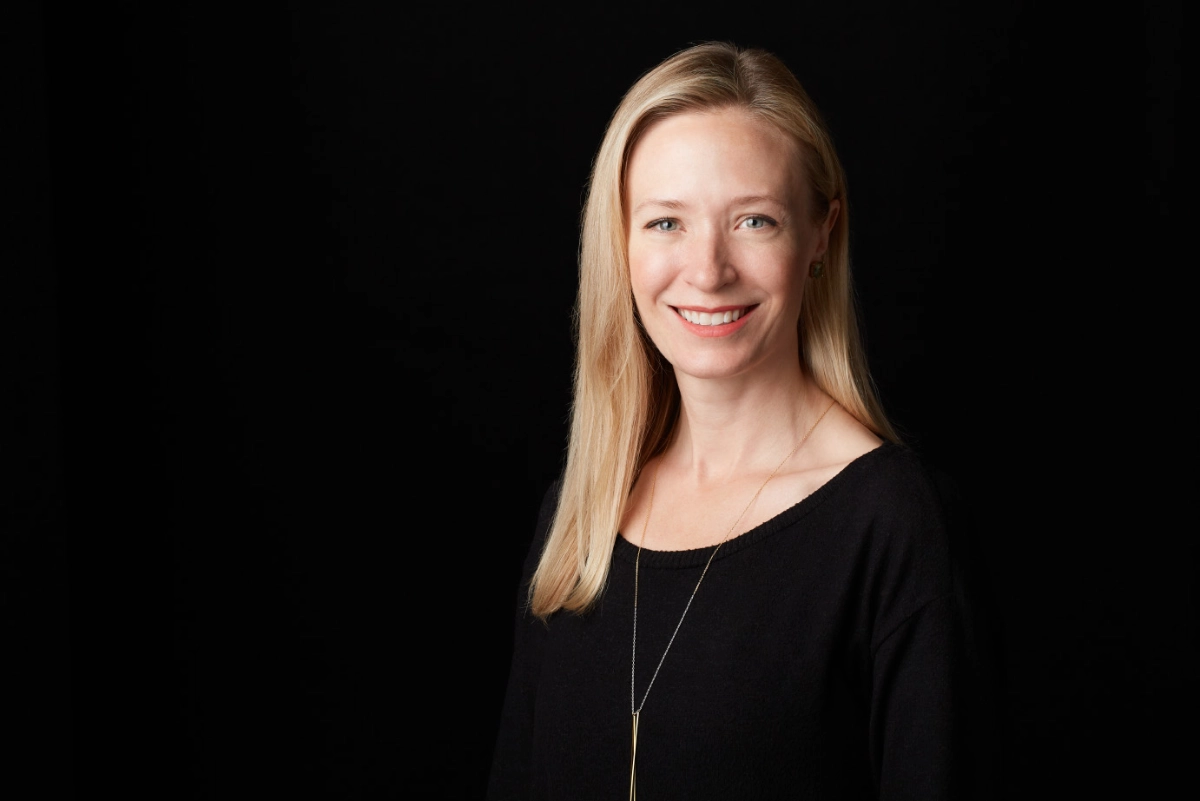 professional corporate headshot of female realtor on a black background taken in a Vancouver photography studio