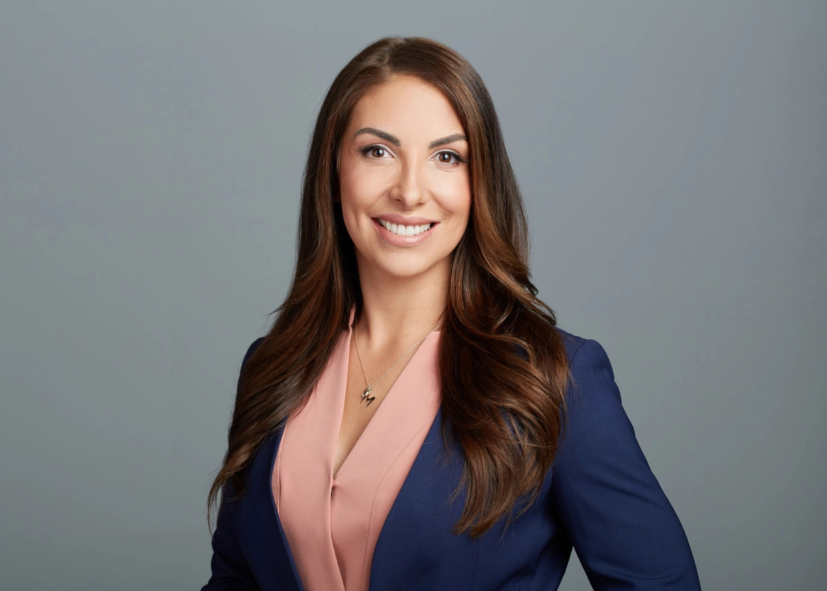 professional photograph of a female executive taken in a Vancouver studio with a grey background