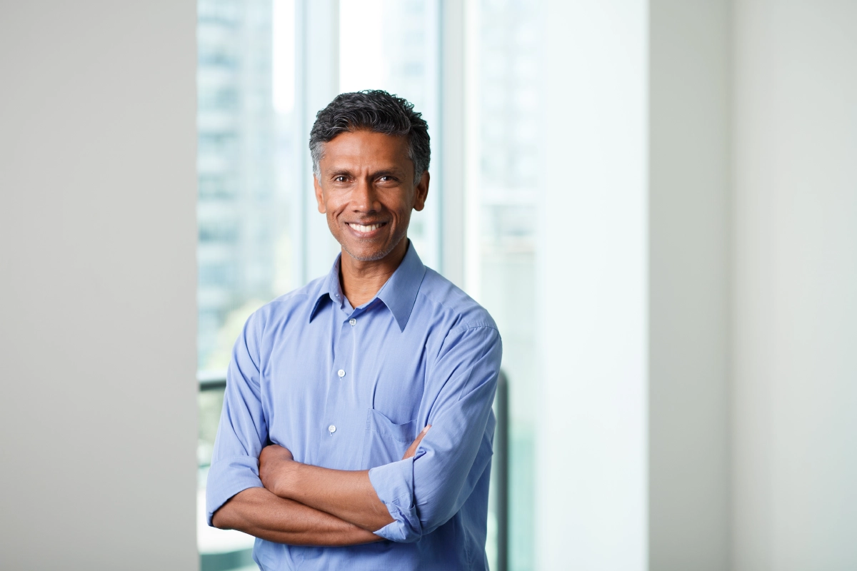 corporate photo of male in a Vancouver office with a window view
